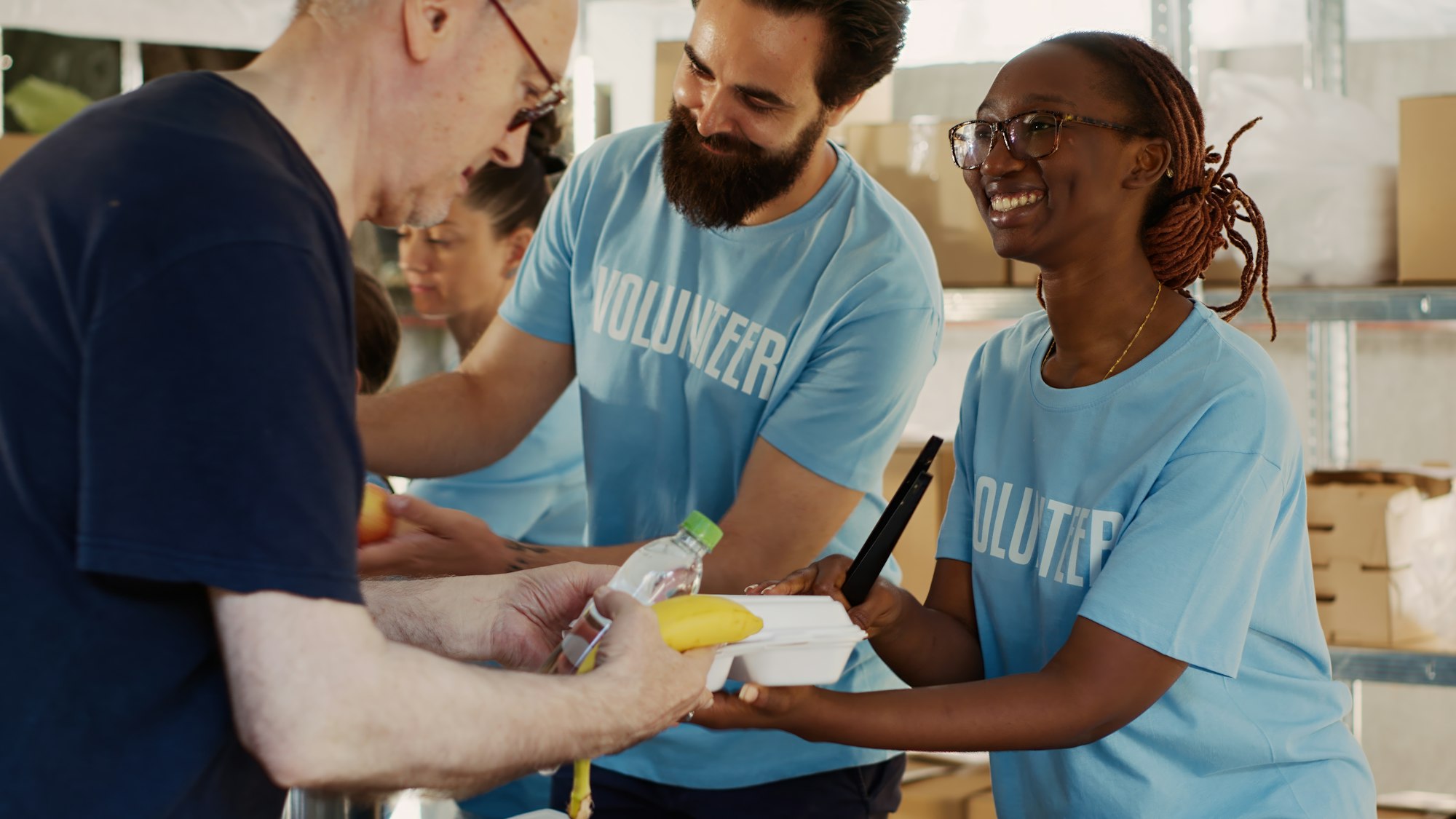 Friendly volunteers serve the homeless